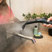 Steam cleaner in use on tiled kitchen floor