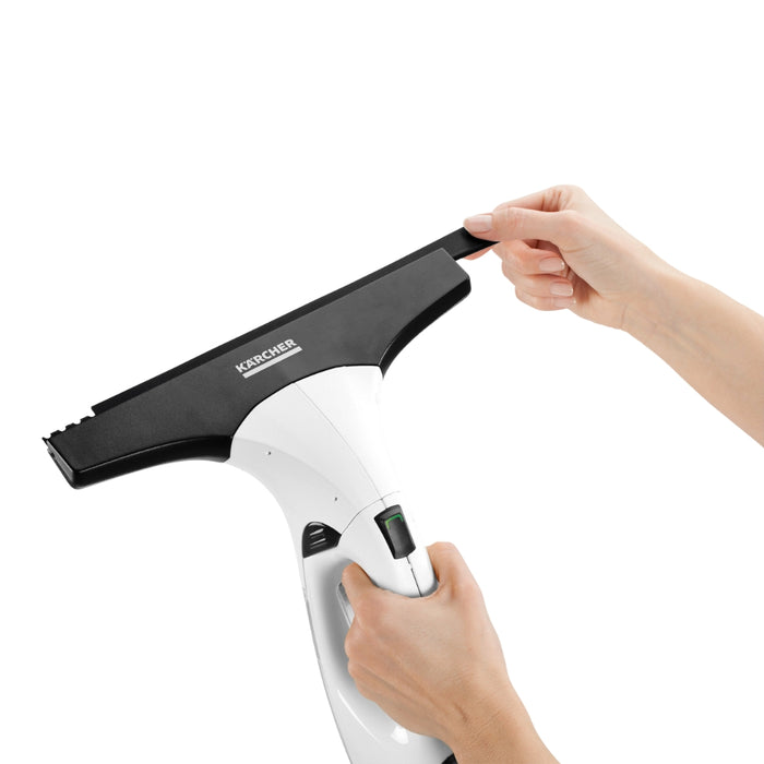 User cleaning tiles using WV 2 Plus window cleaner