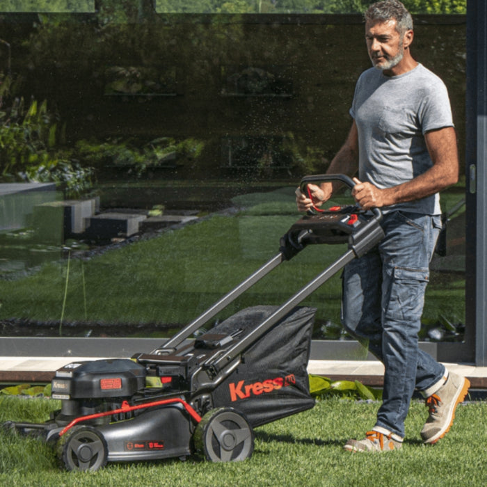 Kress KG760E.9 60V 51 cm Brushless Self-Propelled Lawn Mower Person is Using Lawn Mower
