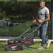 Kress KG760E.9 60V 51 cm Brushless Self-Propelled Lawn Mower Person is Using Lawn Mower