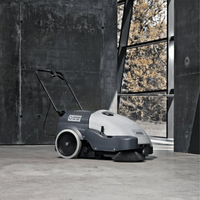 Nilfisk SW750 compact battery walk-behind sweeper offering powerful sweeping performance for indoor and outdoor floor areas
