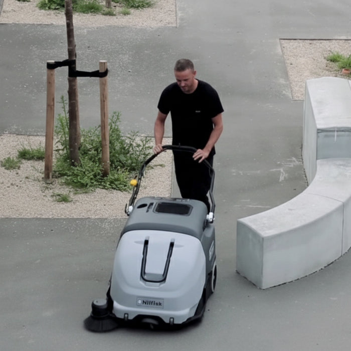 Nilfisk SW900 durable large walk-behind battery powered sweeper built for heavy-duty daily cleaning of expansive floor spaces